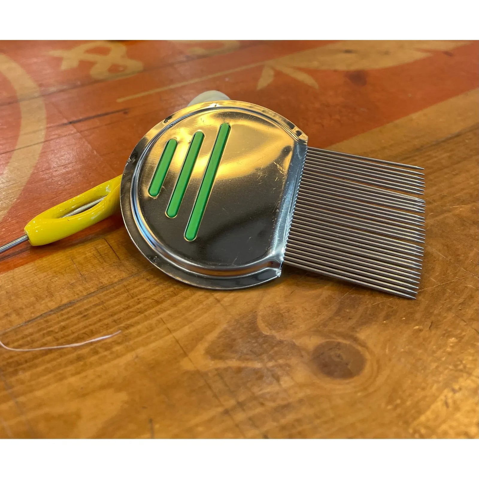 Side view of 239 Fiber Brush fly tying comb with green inlay detail