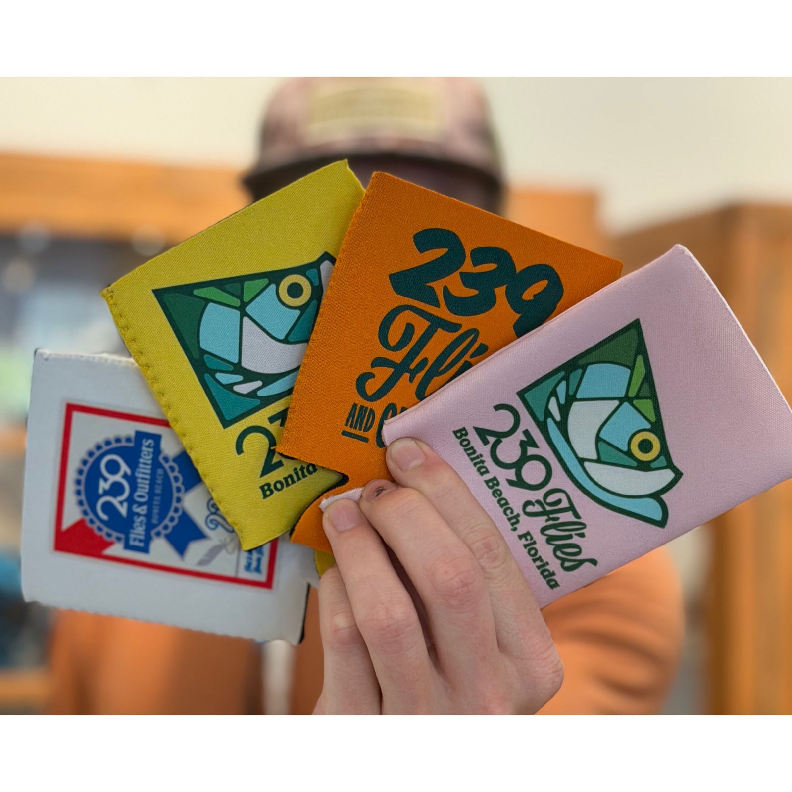 Set of four 239 Flies neoprene koozies in white, yellow, orange, and pink with Bonita Beach Florida logos