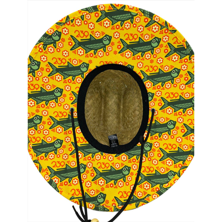 Straw hat interior showing yellow fish pattern lining and drawstrings