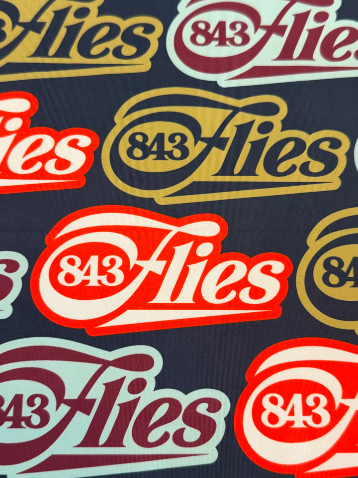 Close-up of polyester texture on Heritage Buff sun mask showing detailed logo print