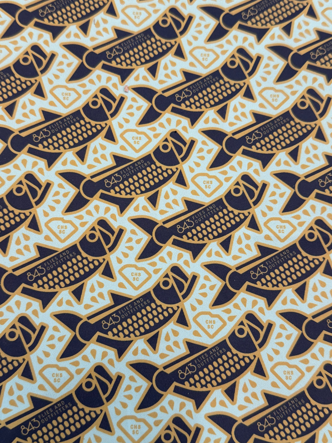 Close-up of light blue polyester sun mask fabric texture
