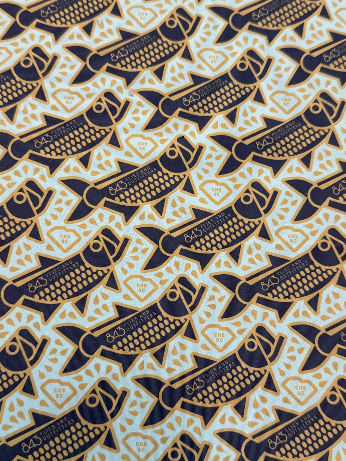 Close-up of light blue polyester sun mask fabric texture
