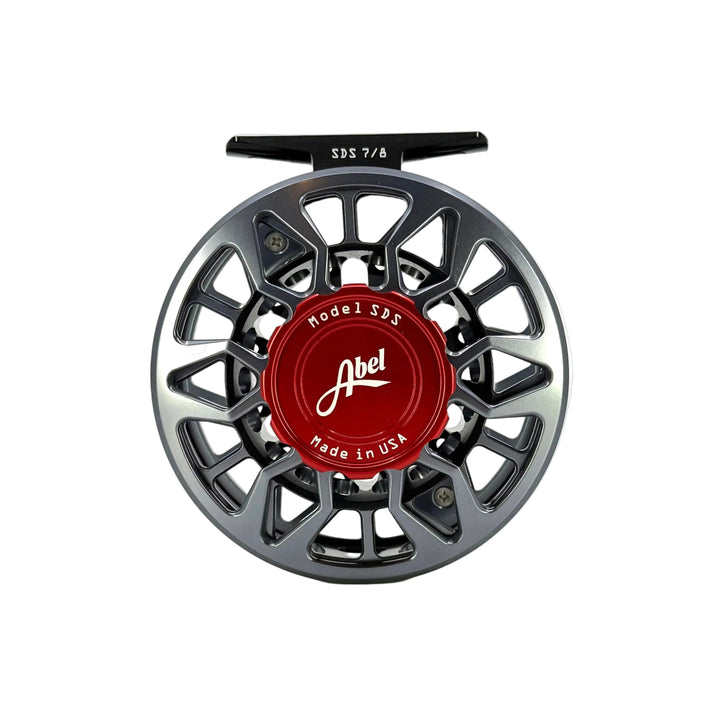 Front view of Abel SDS 7/8 fly reel showing red drag knob and Made in USA engraving
