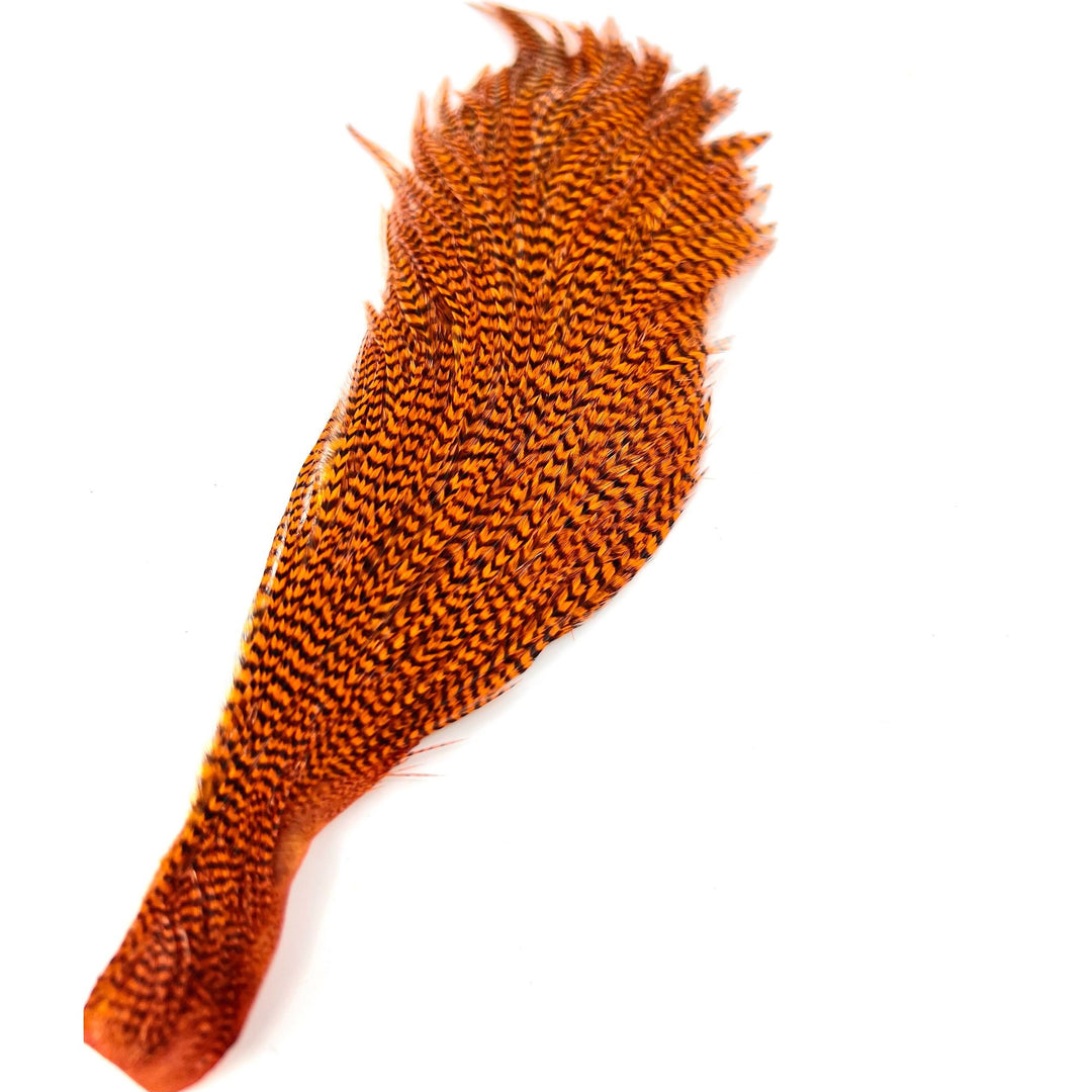 Ewing Grizzly Half Cape fly tying feather with orange-brown and black barring