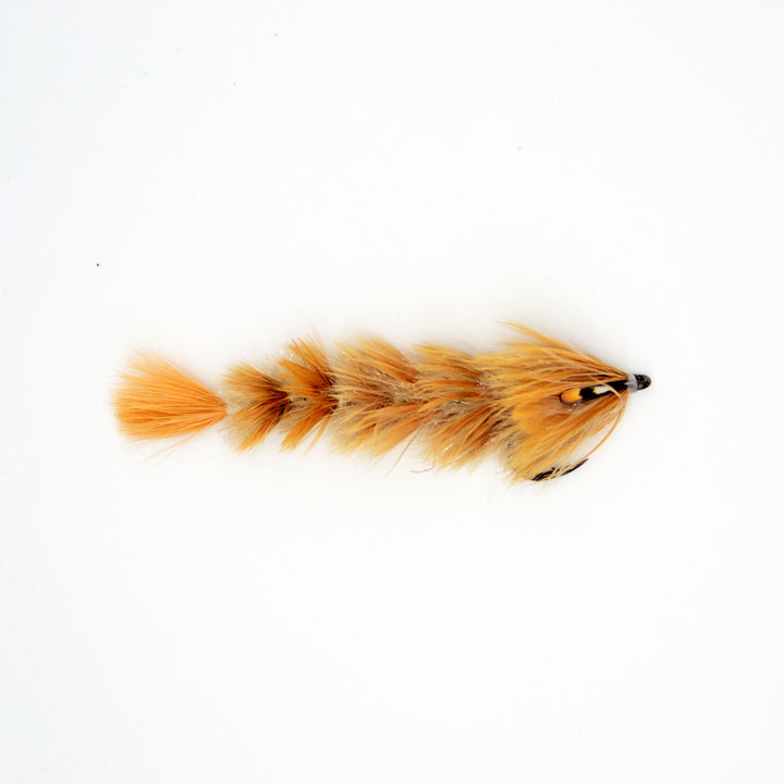 Orange and tan FeatherLite Changer fly with segmented feather body