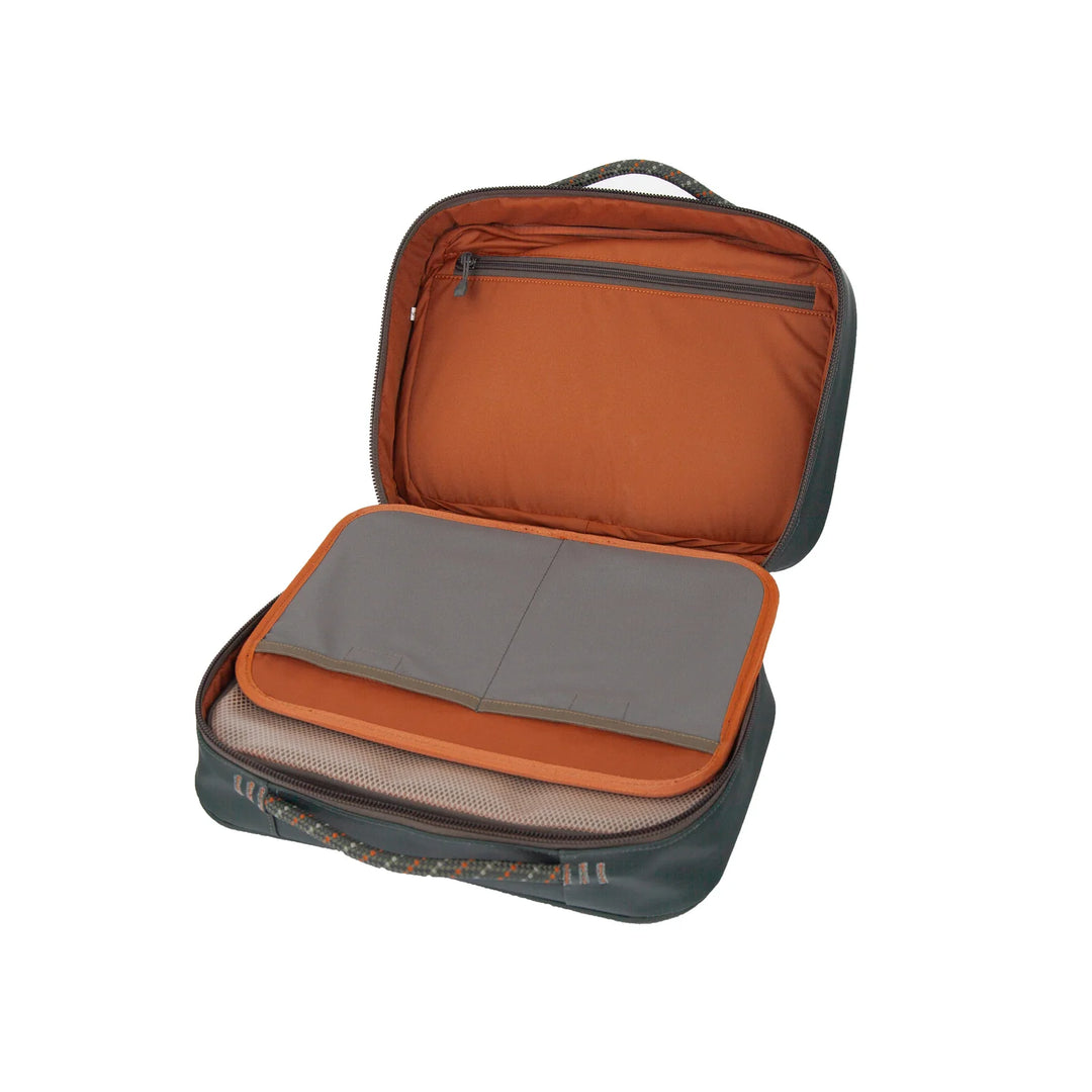 Fishpond Backwater Fly Tying Kit open showing grey organizer panel with orange piping and mesh bottom