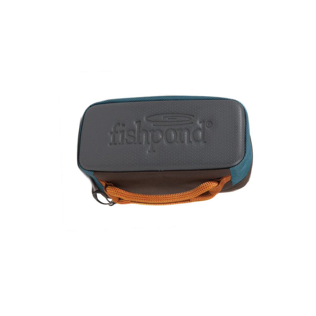 Bottom view of Fishpond Ripple Reel Case with molded base and orange carry handle