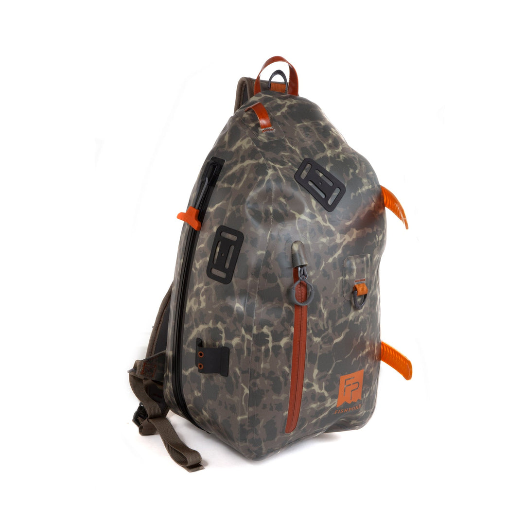 Fishpond Thunderhead Submersible Sling bag in grey riverbed camo with orange zipper pulls