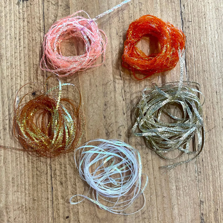 Assorted Hareline flat diamond braid colors including pink, orange, and blue flash