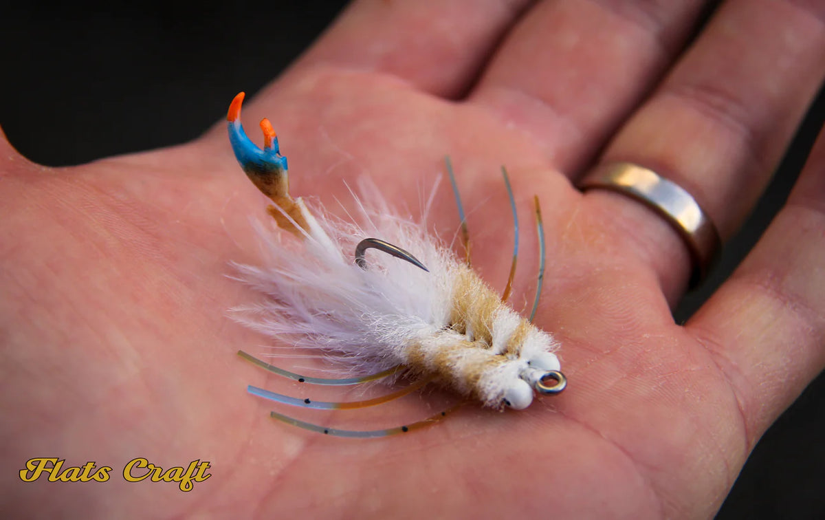Flats Craft The Claw white fly with blue resin claw and translucent legs
