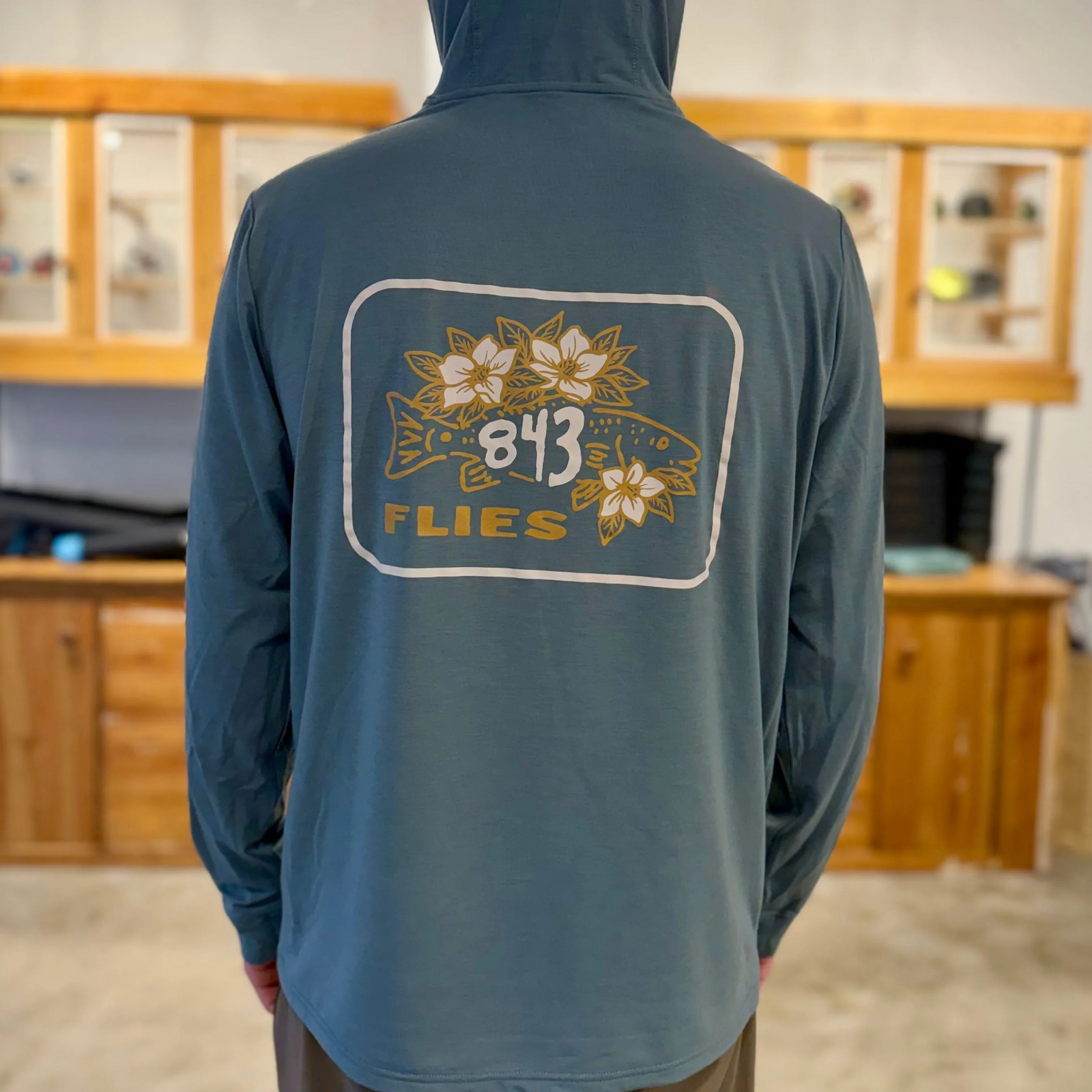 Free Fly Elevate Hoodie back view featuring large 843 Flies fish and Sweet Magnolia print
