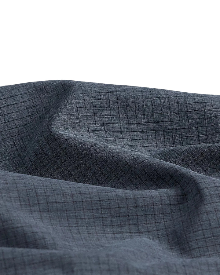Close-up of dark grey Marquesas Guide Pant micro-perforated grid texture