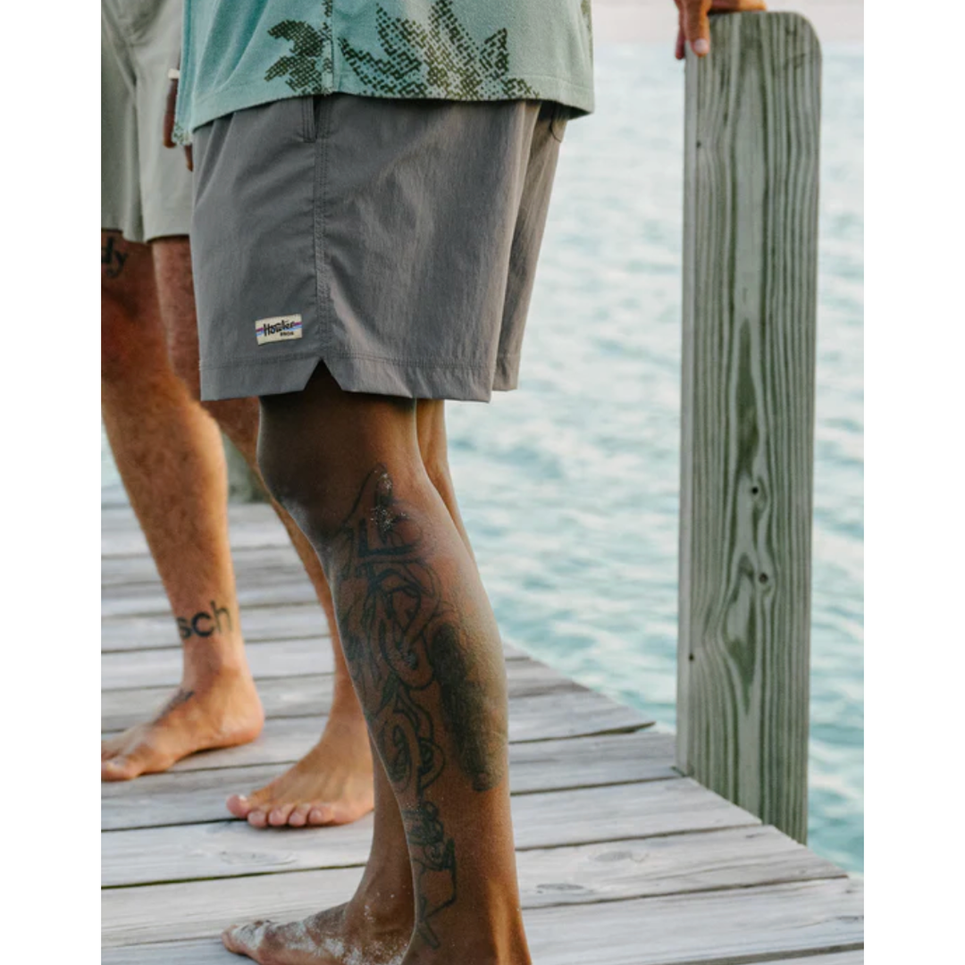 Howler Bros Salado Shorts charcoal worn on dock