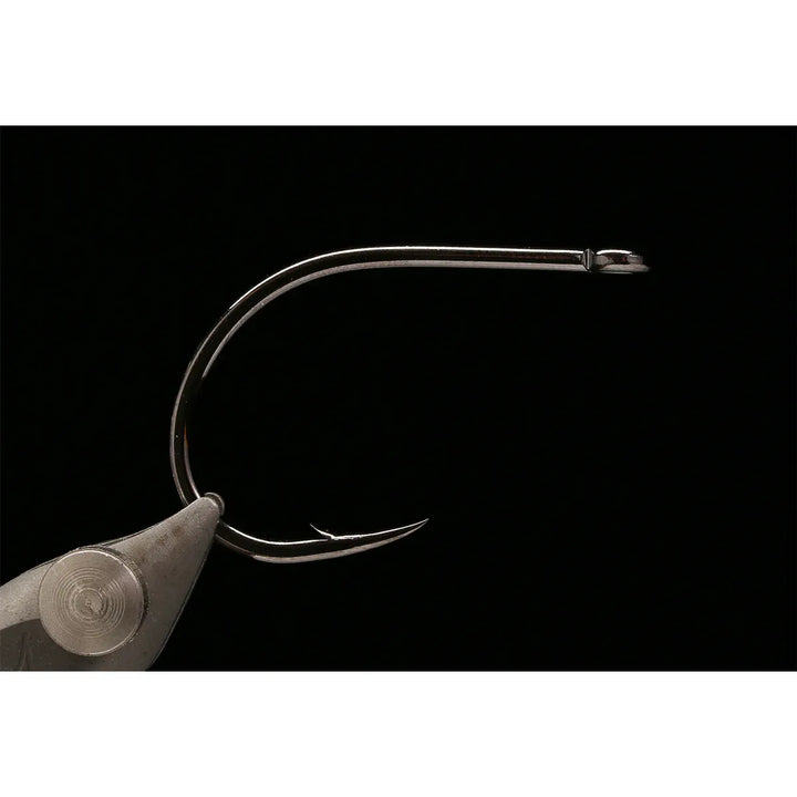 Macro view of Kona black-nickel barbed point and straight eye hook