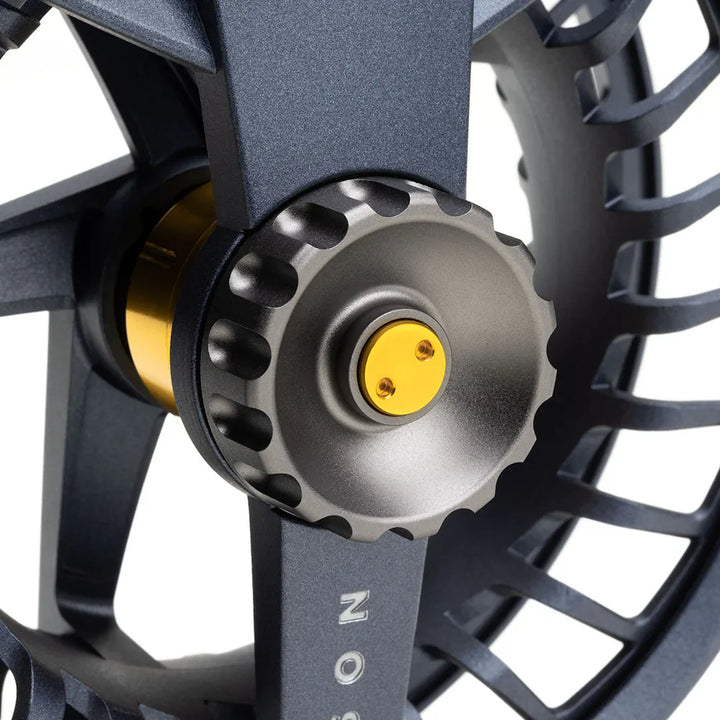 Close-up of Cobalt Drag System cone on Lamson Liquid MAX fly reel with scalloped edges