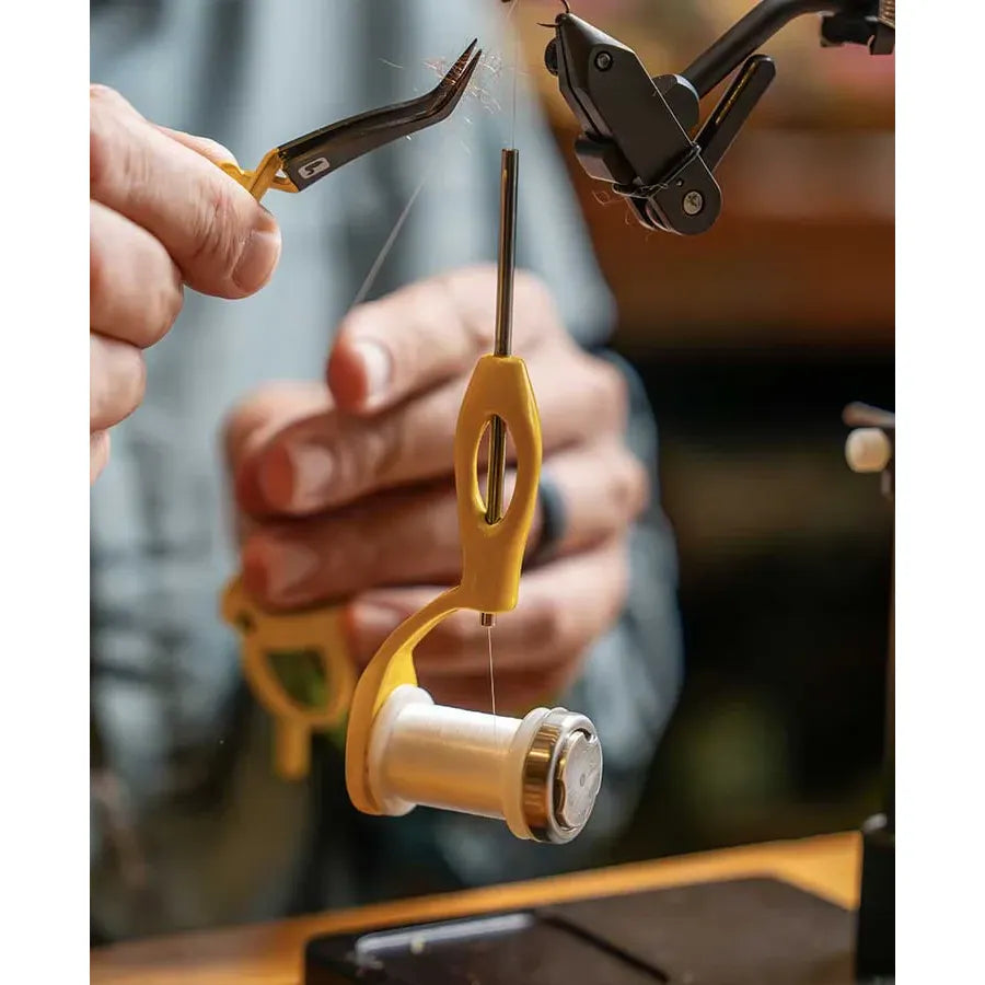Yellow Loon Outdoors Ergo Bobbin in use for fly tying with thread path