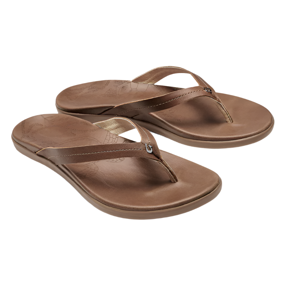 Olukai Honu tan sandals with honu laser-etched footbed detail