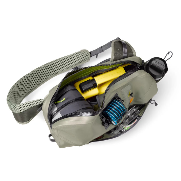 Orvis PRO Waterproof Sling Pack open showing internal organization for fishing gear