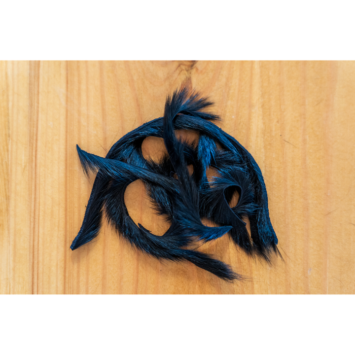 Electric blue dyed squirrel fur zonker strip on leather backing