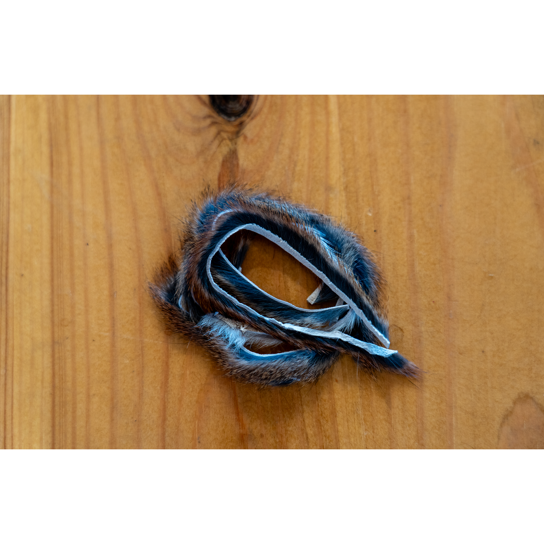 Multi-color silver and rust squirrel fur zonker strip