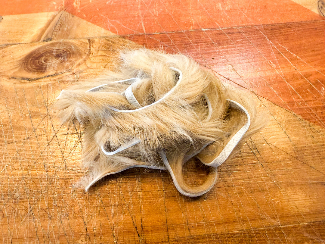 Tan rabbit fur strips for fly tying
