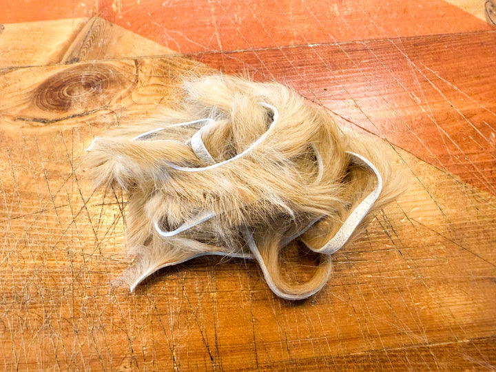 Tan rabbit fur strips for fly tying