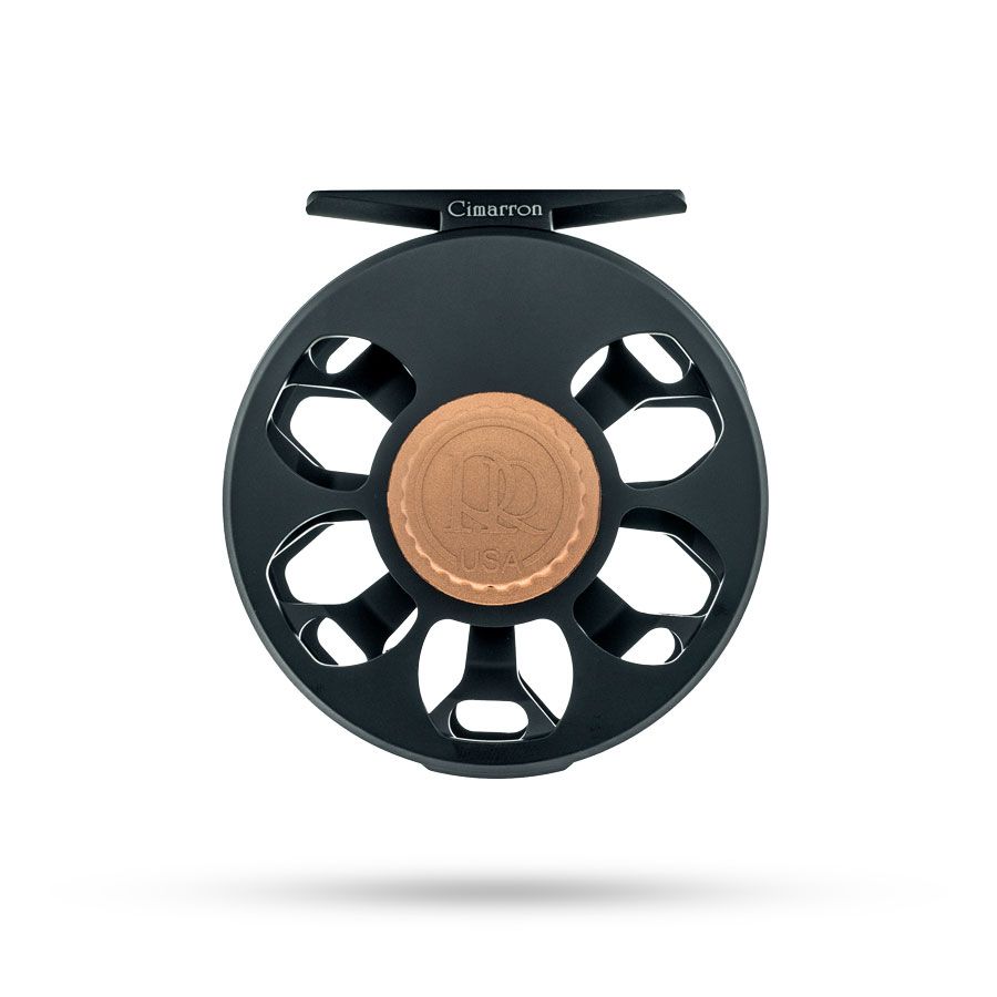 Close-up of Ross Cimarron reel showing copper USA medallion and eight-spoke design