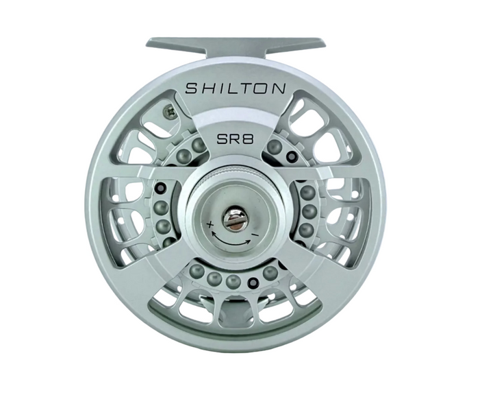 Top view of Shilton SR8 titanium fly reel showing engraved drag adjustment