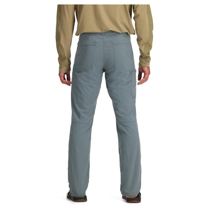 Back view of grey Simms Superlight pants showing zippered back pocket and knee seams