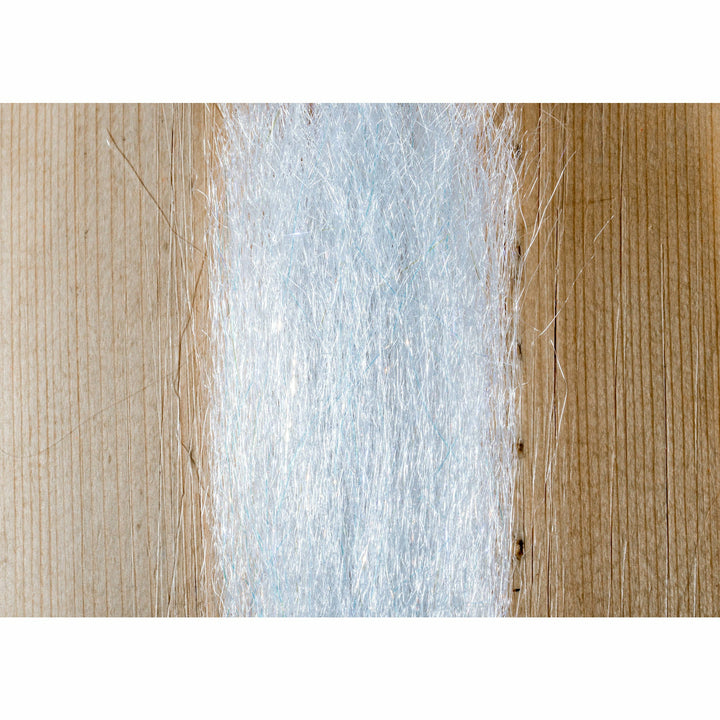 Silvery-white pearlescent fly tying material reflecting pale blue light