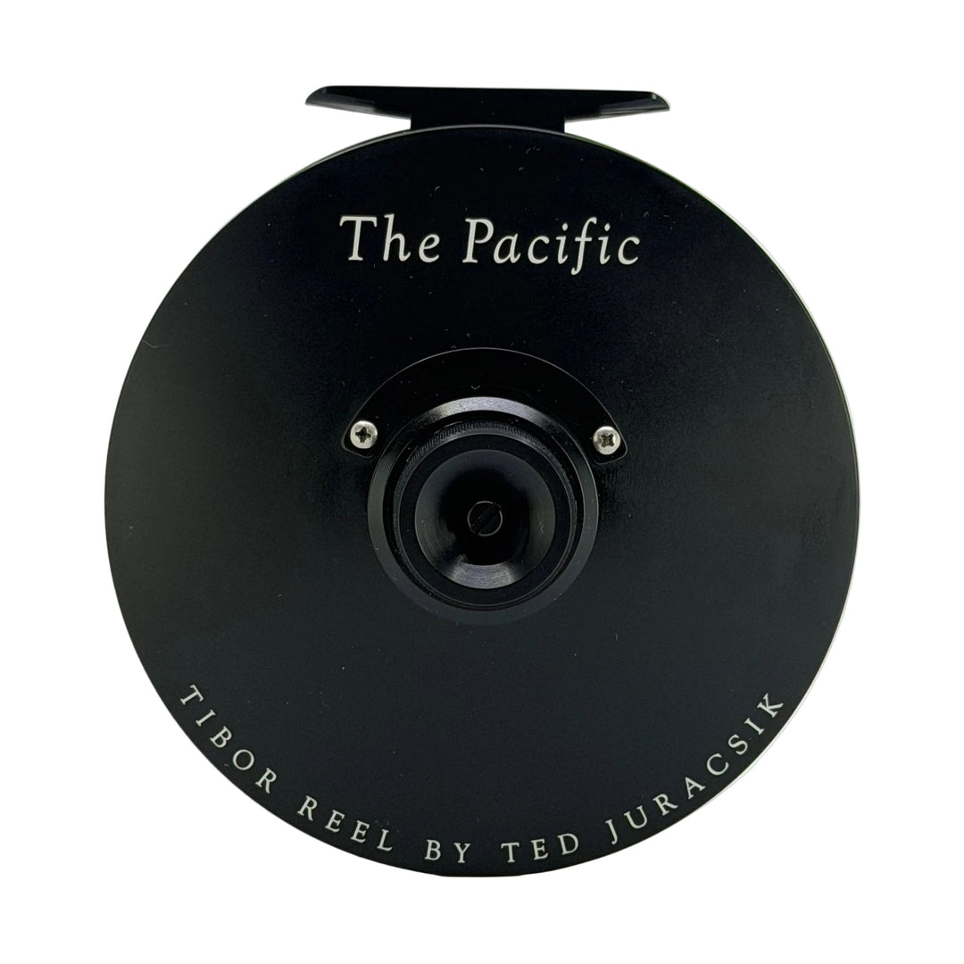Tibor Pacific Frost Black fly reel top view with white lettering