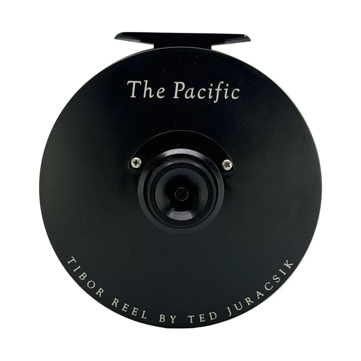 Tibor Pacific Frost Black fly reel top view with white lettering