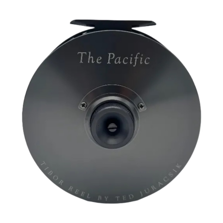 Tibor Pacific graphite fly reel side plate detail with engraved logo and drag knob