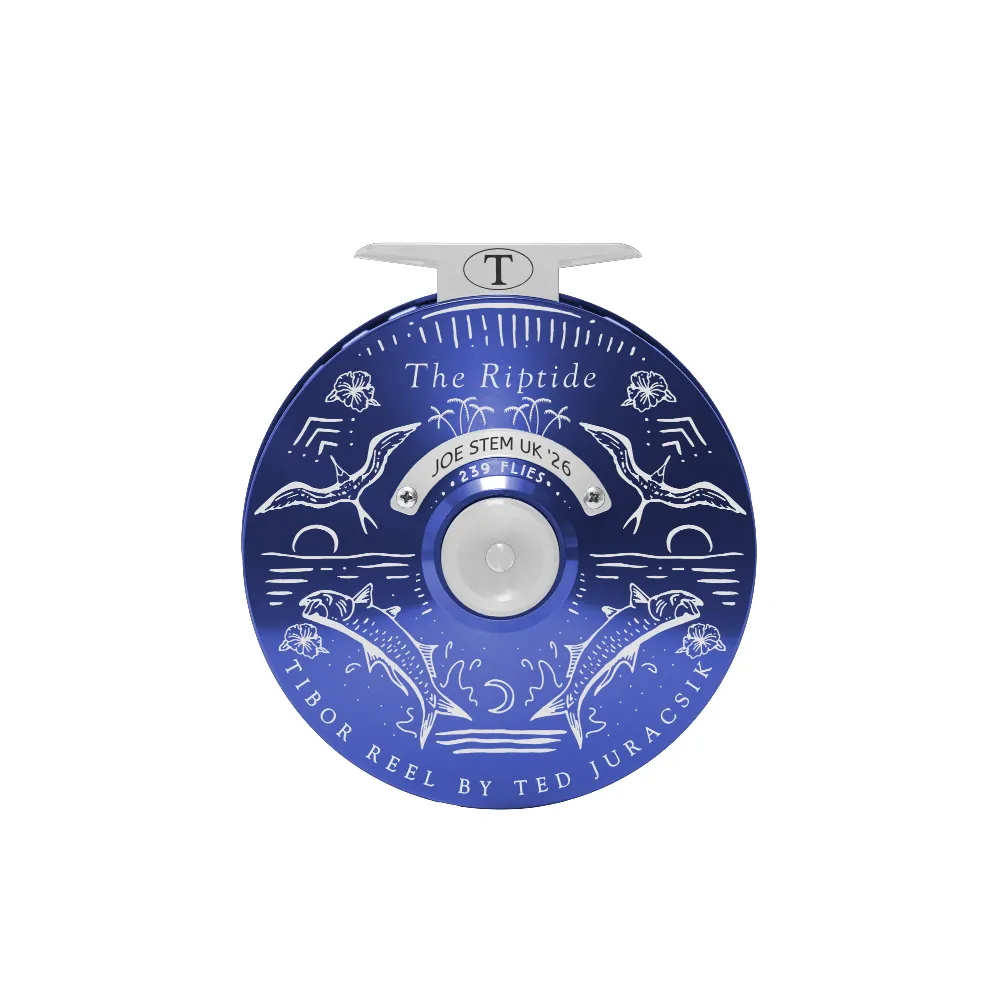 Royal blue Tibor Riptide fly reel with frost silver accents and custom Joe Stem UK '26 tarpon engraving