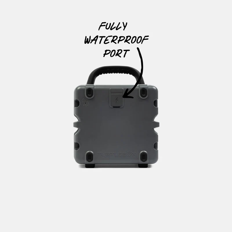 Rear view of waterproof Turtle Box Cub speaker showing sealed port cover and rubber feet