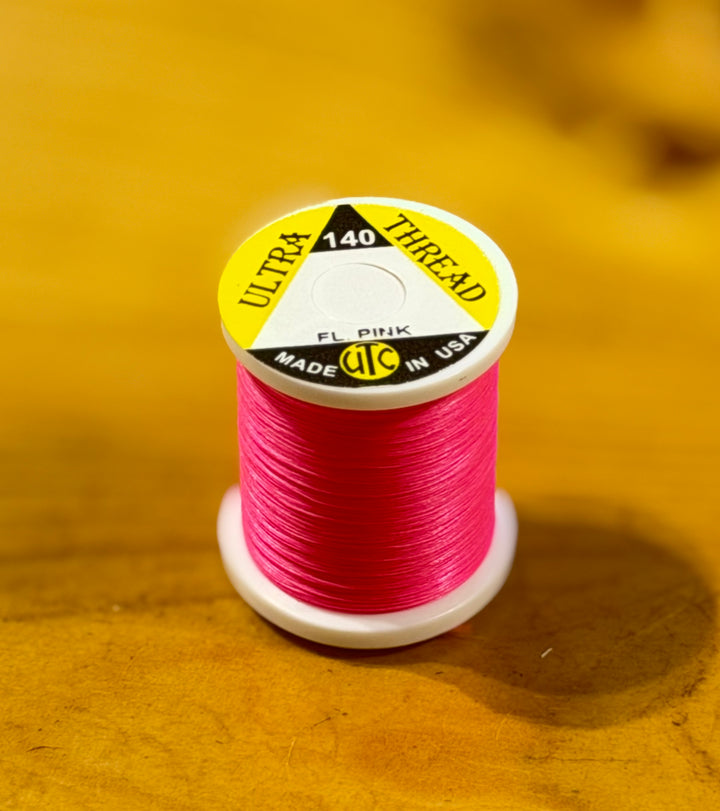Bright Fluorescent Pink UTC Ultra 140 thread spool