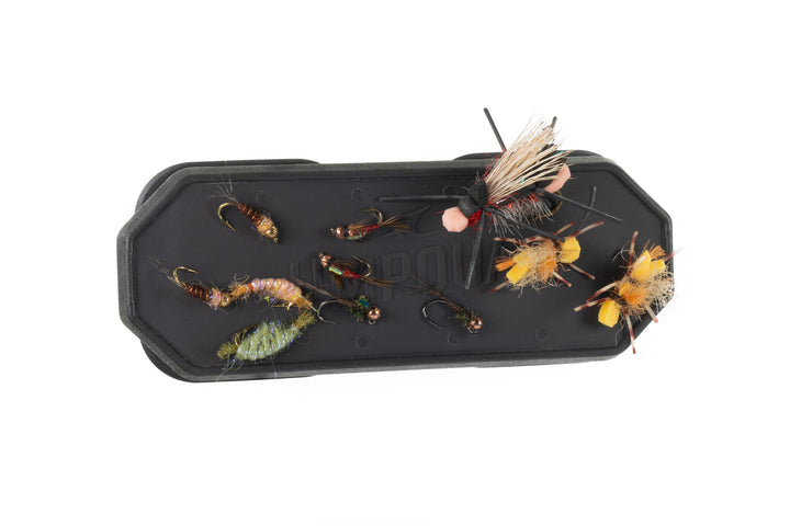 Umpqua magnetic fly dock holding colorful dry flies and nymphs
