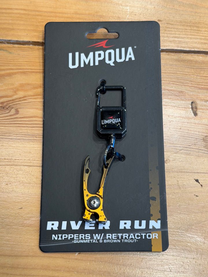 Umpqua RiverRun Nipper in gunmetal and brown trout finish on retail hang tag
