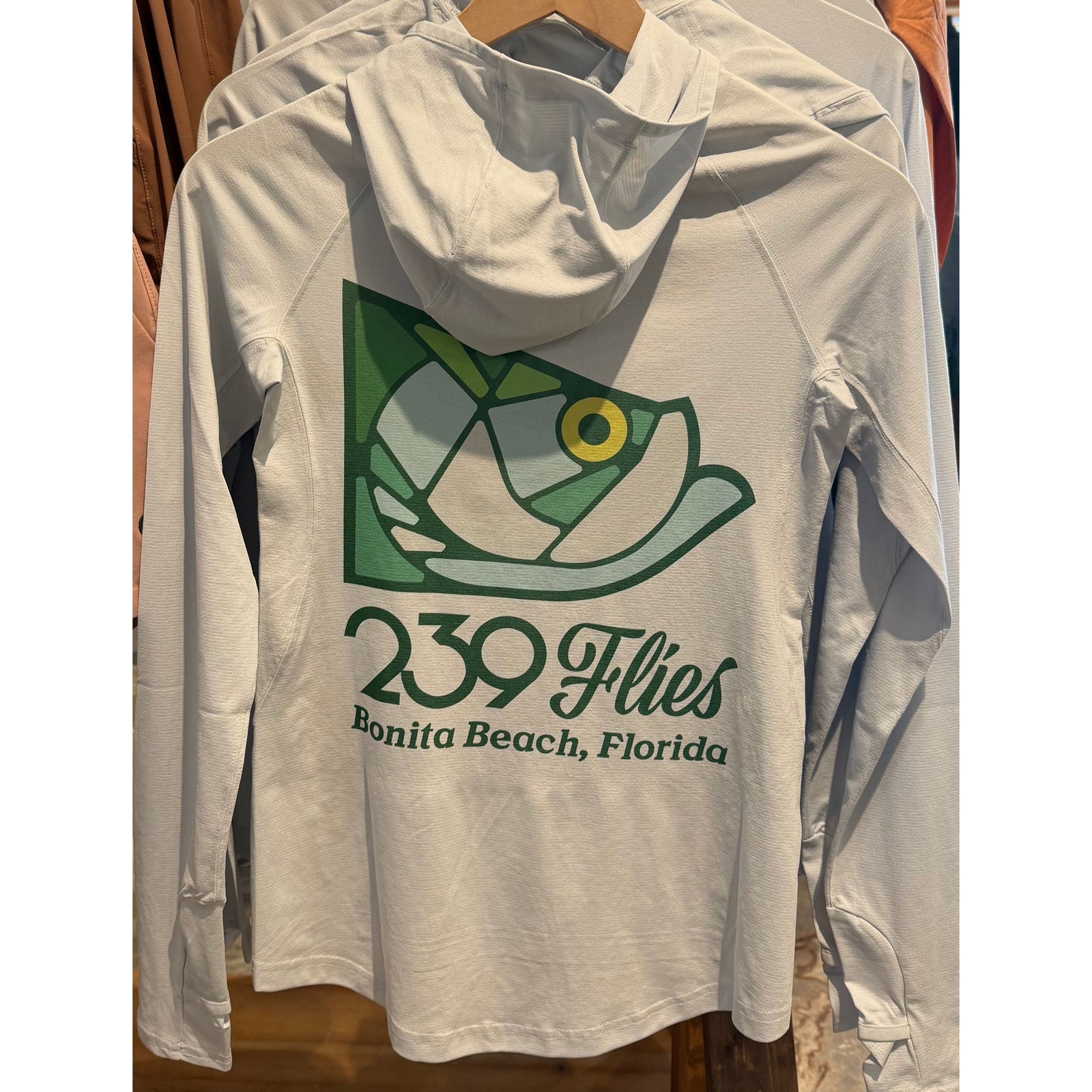 W's Simms Solarflex Hoody Bimini Blue back view with stained glass tarpon graphic and UPF 50+ sun protection
