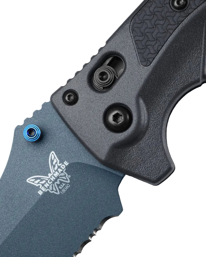 Close-up of Benchmade Adira pivot showing blue hardware, frame lock, and etched logo