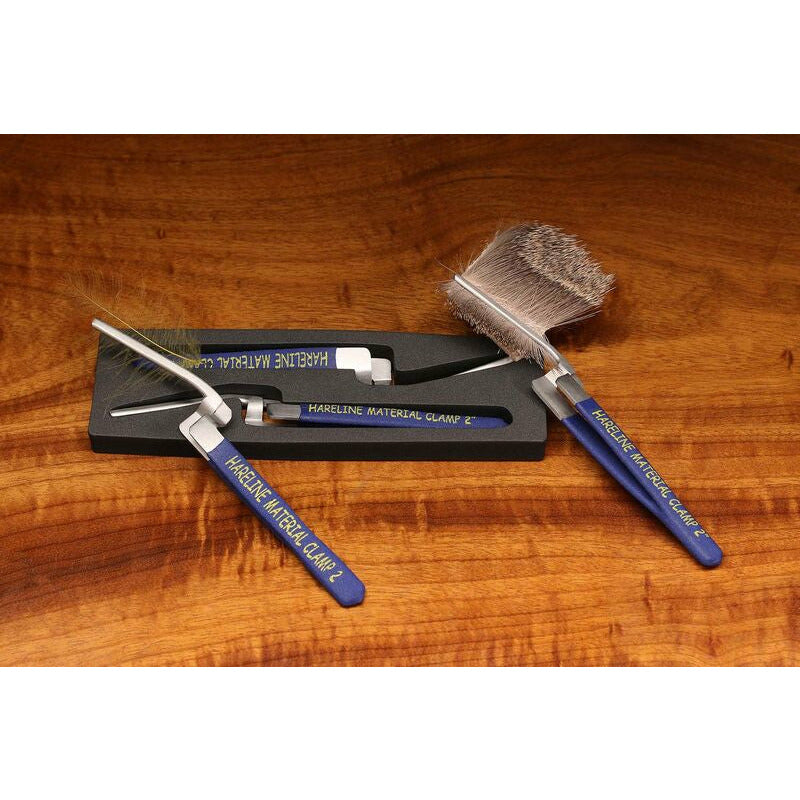 Hareline 2 inch material clamps holding dubbing and hareline fur on foam tray