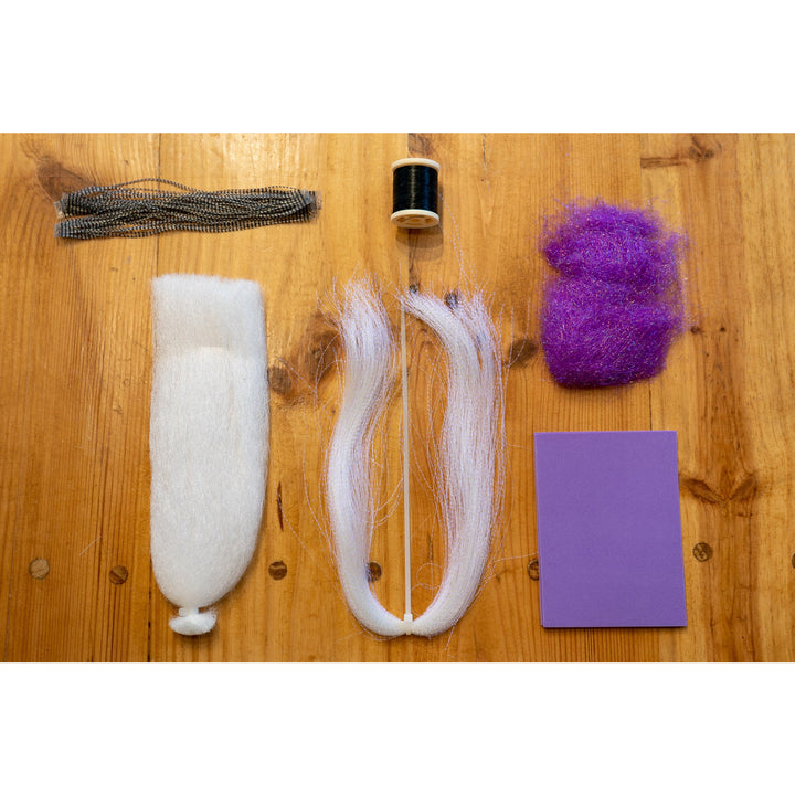 Chubby Chernobyl DIY Kit materials: purple ice dub, krystal flash, foam, micro legs, and thread