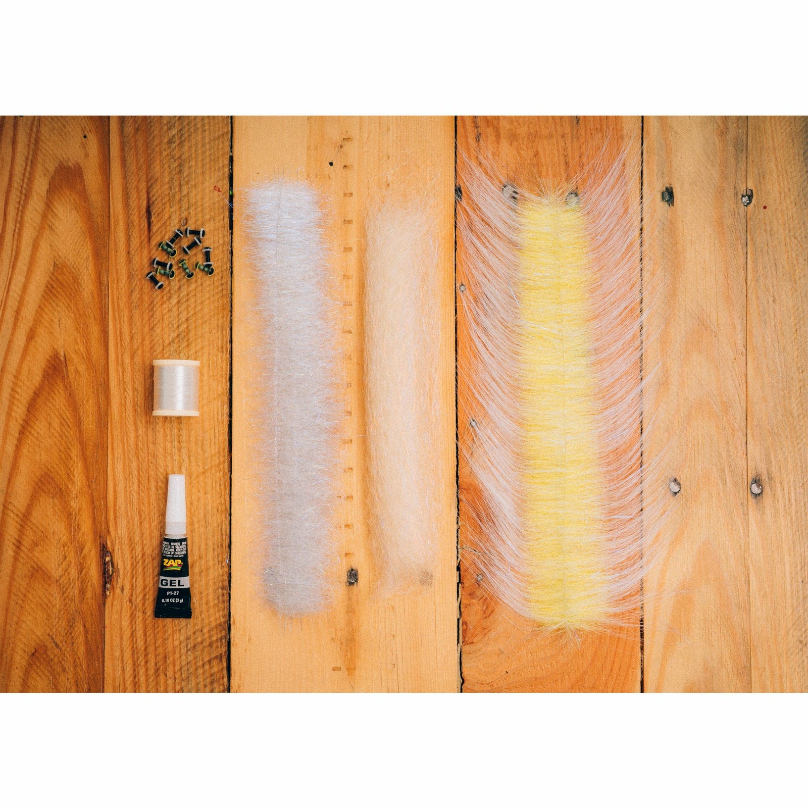 DL3 Minnow DIY Kit contents including ZAP glue, thread, eyes, and cream SF fibers