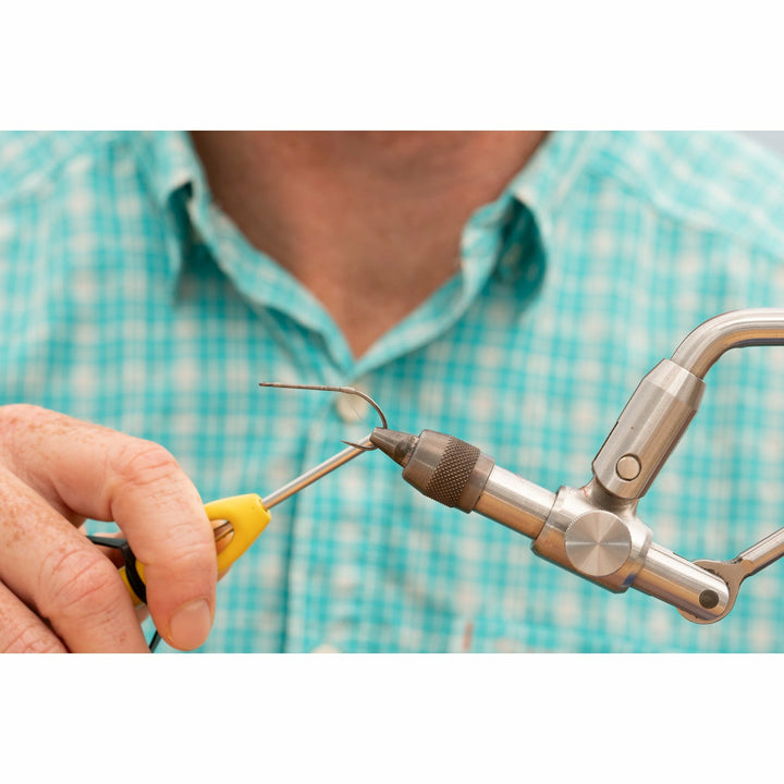 Empty silver hook secured in vise ready for DL3 Minnow DIY Kit assembly