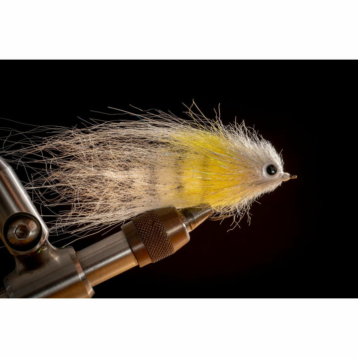 Finished Banana Creme DL3 Minnow fly with yellow belly and silver body on black background