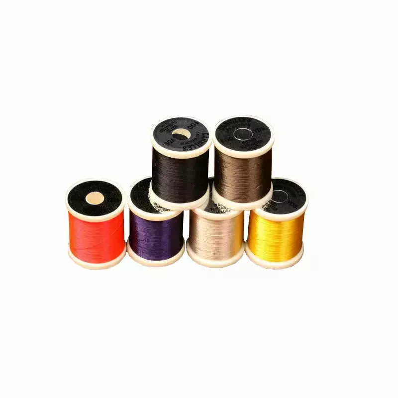 Danville 140 Denier Fly Tying Thread spools in assorted colors including red, purple, gold, yellow, black, and brown