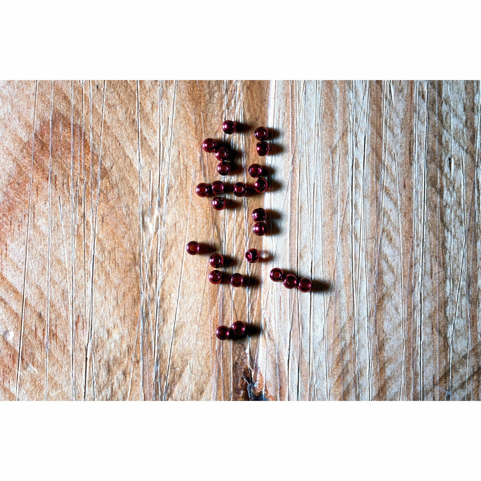 Hareline Dazzle Brass Beads in Blood Red for fly tying