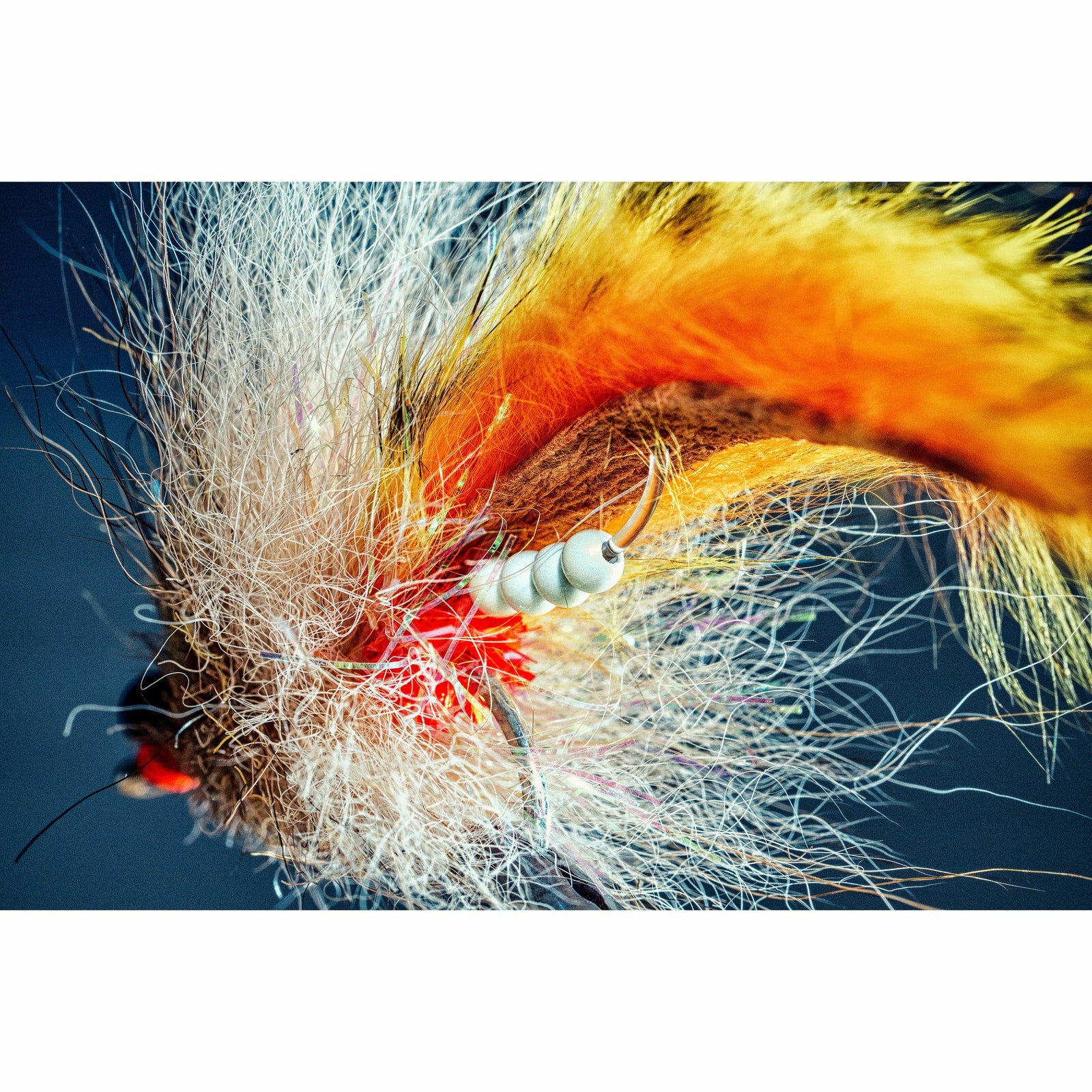 Fly fishing lure with white body and bead chain detail