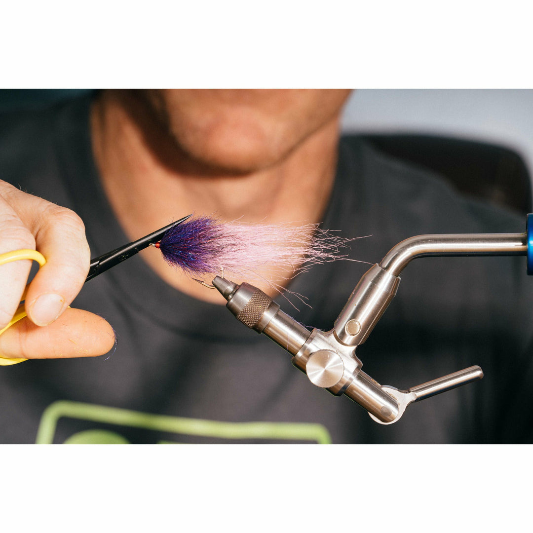 Finished neon grape minnow fly with purple head and pink tail