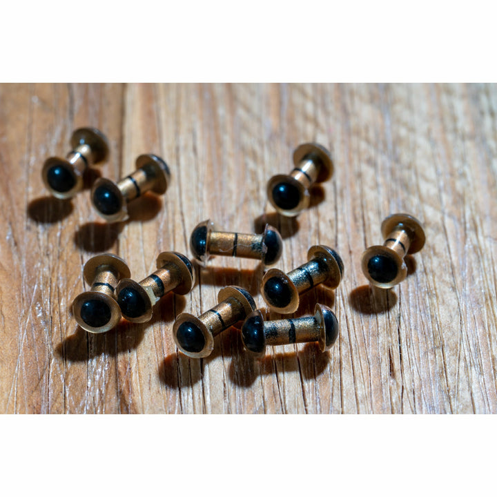 Close-up of matte gold metal construction and glossy black eye lenses